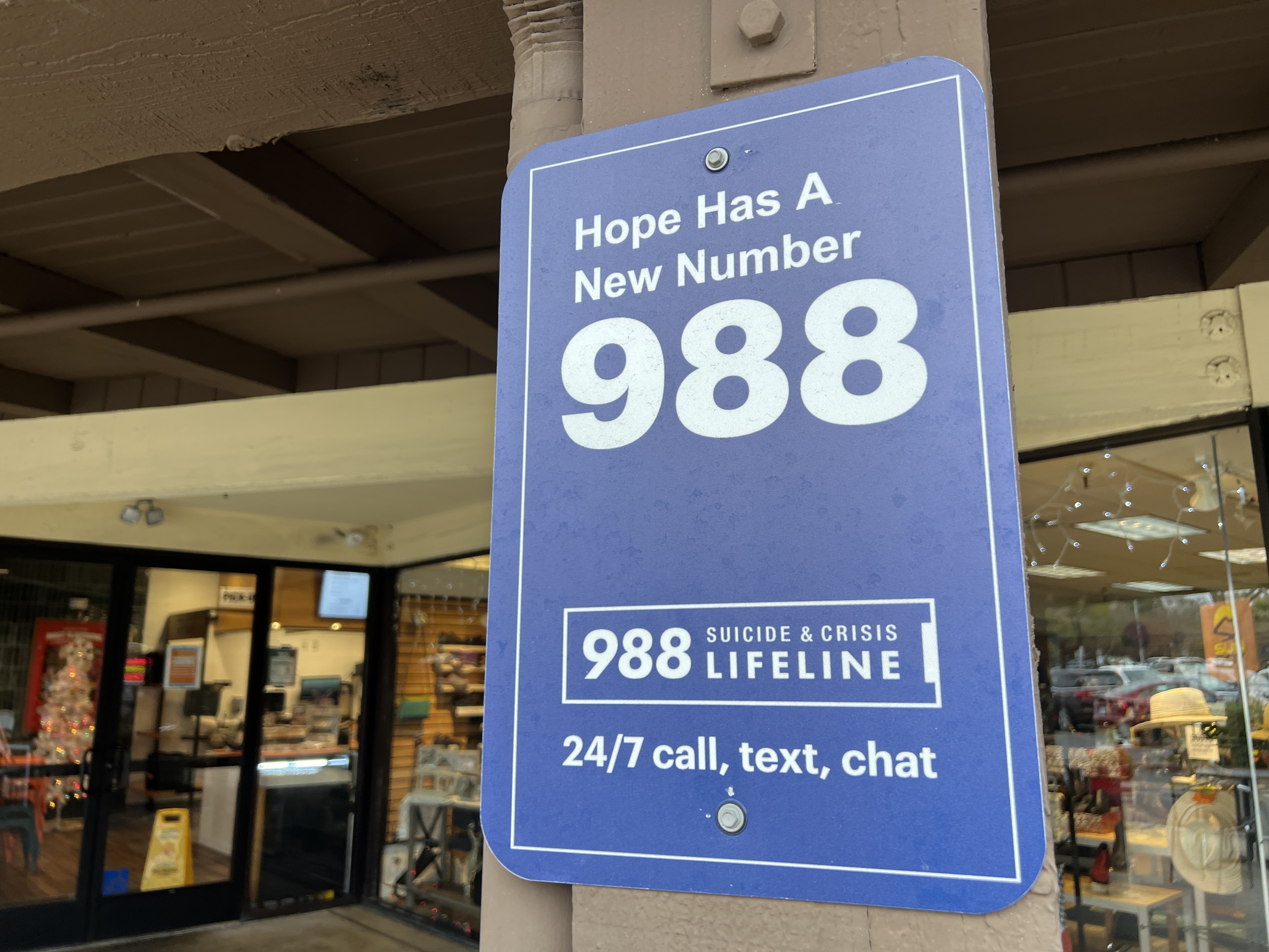 Sign for the 988 Lifeline mental health emergency hotline, Walnut Creek, California, December 20, 2024. The Trump administration has laid off more than 100 employees at the agency responsible for overseeing the number.